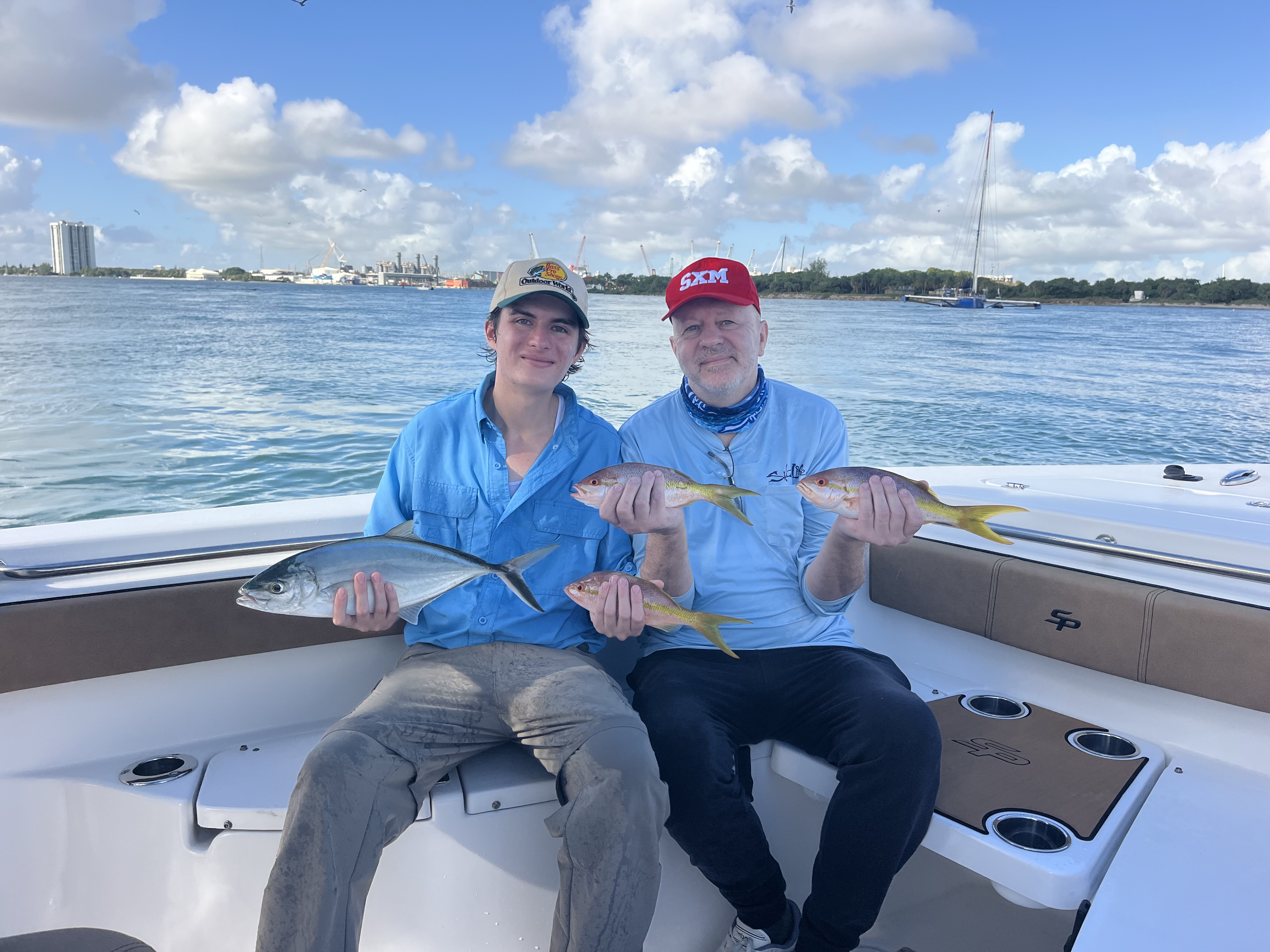 Yellowtail Snapper and a Rainbow Runner on the Reef