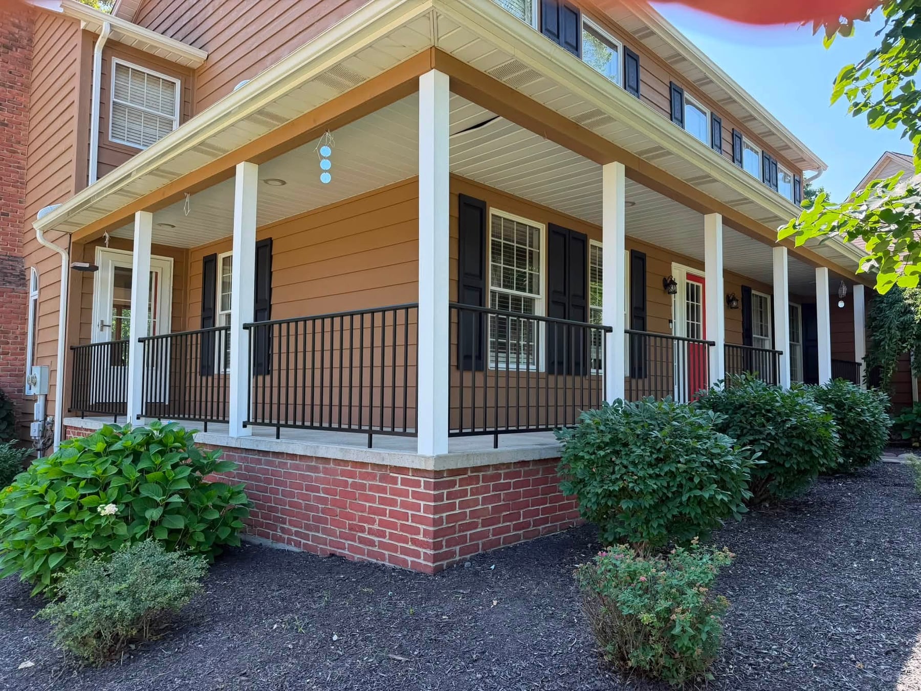 A front porch with fresh cedar stain