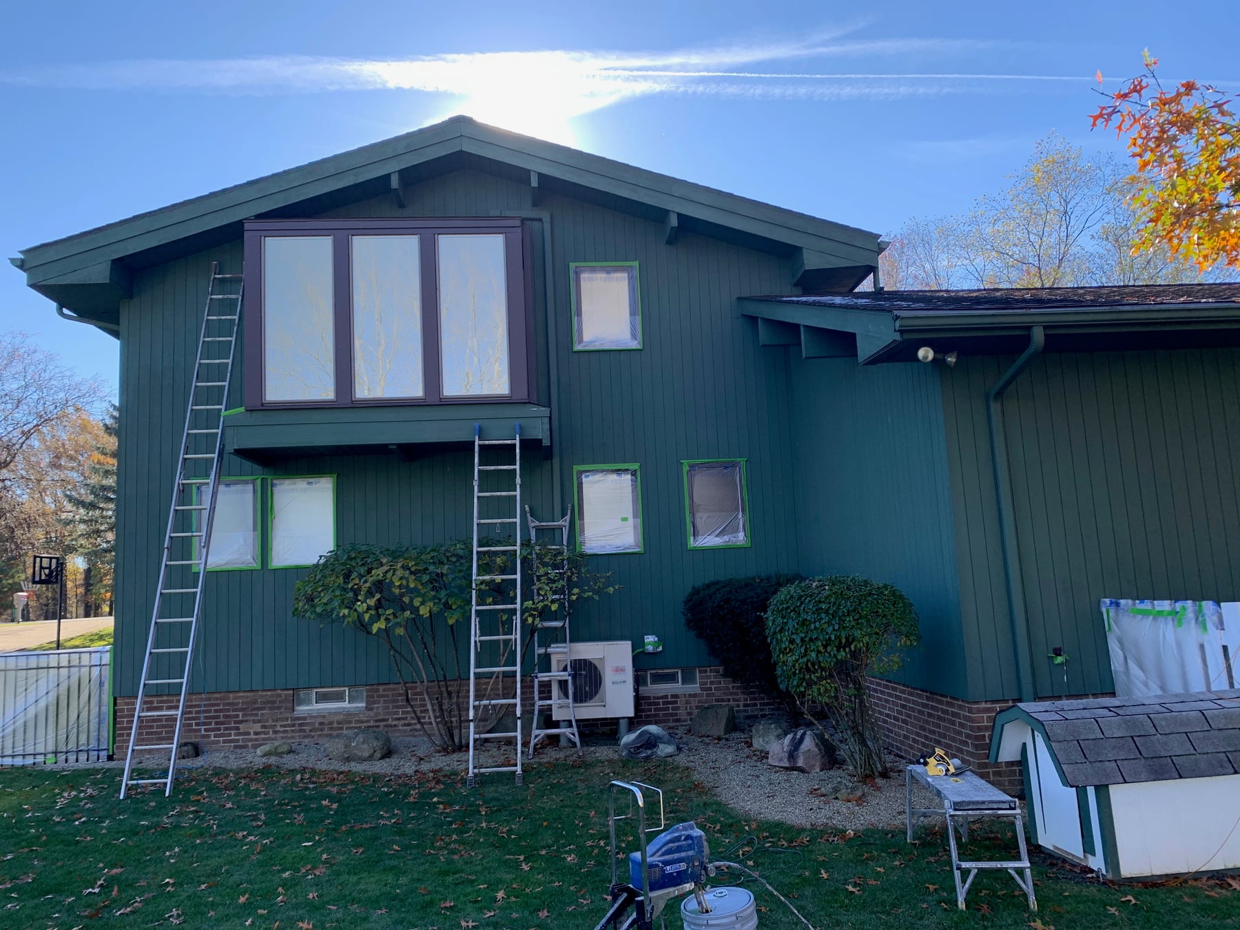A green house after an exterior repaint