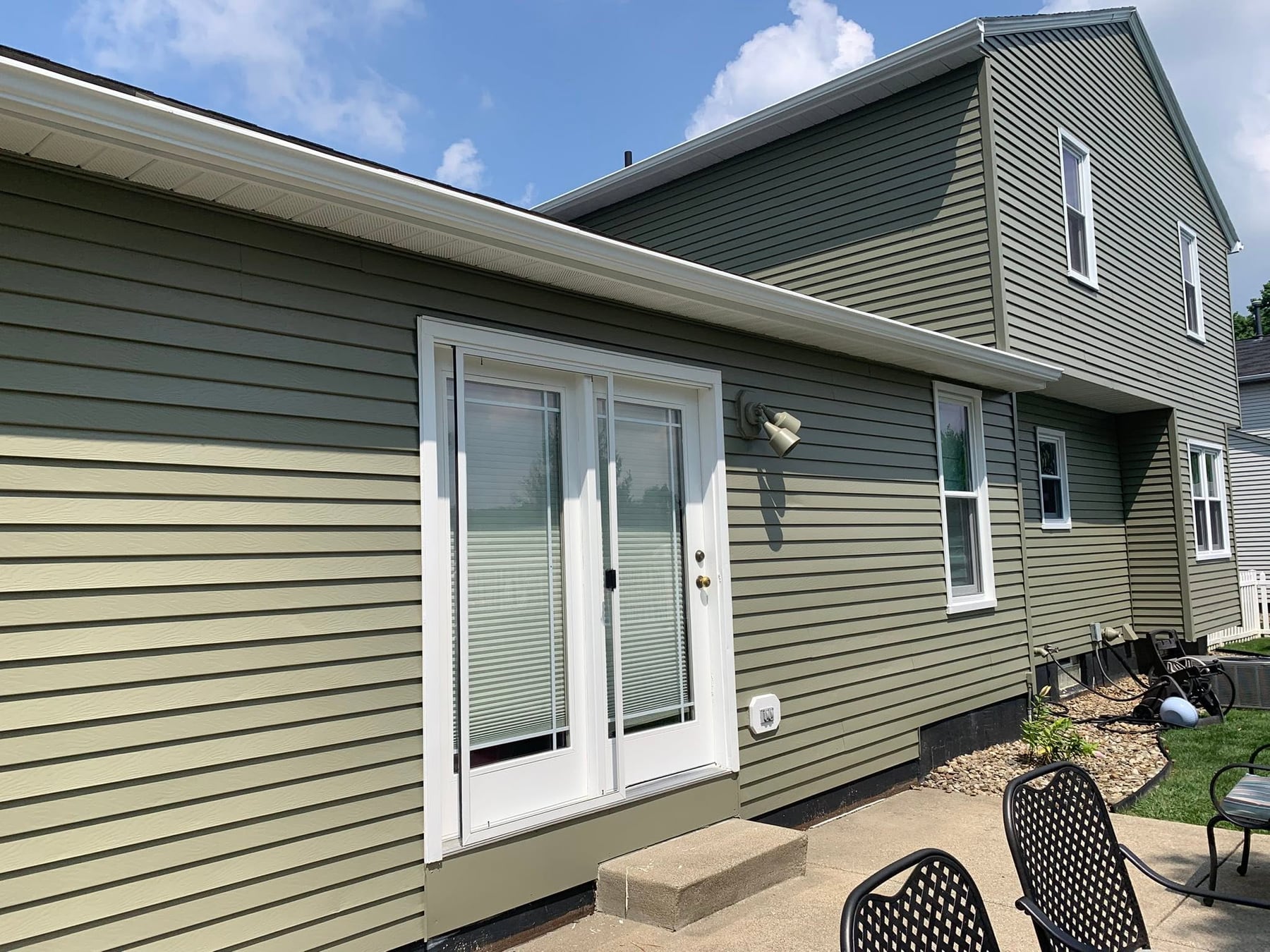 Sage green siding after a repaint