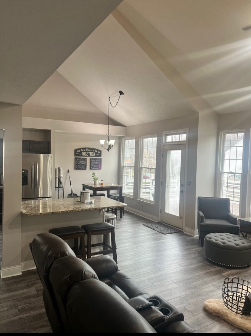 An open kitchen with painted walls and cabinets