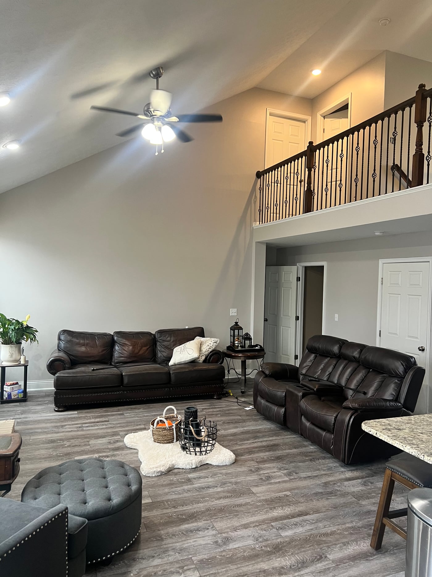 A living room with a vaulted ceiling, freshly painted