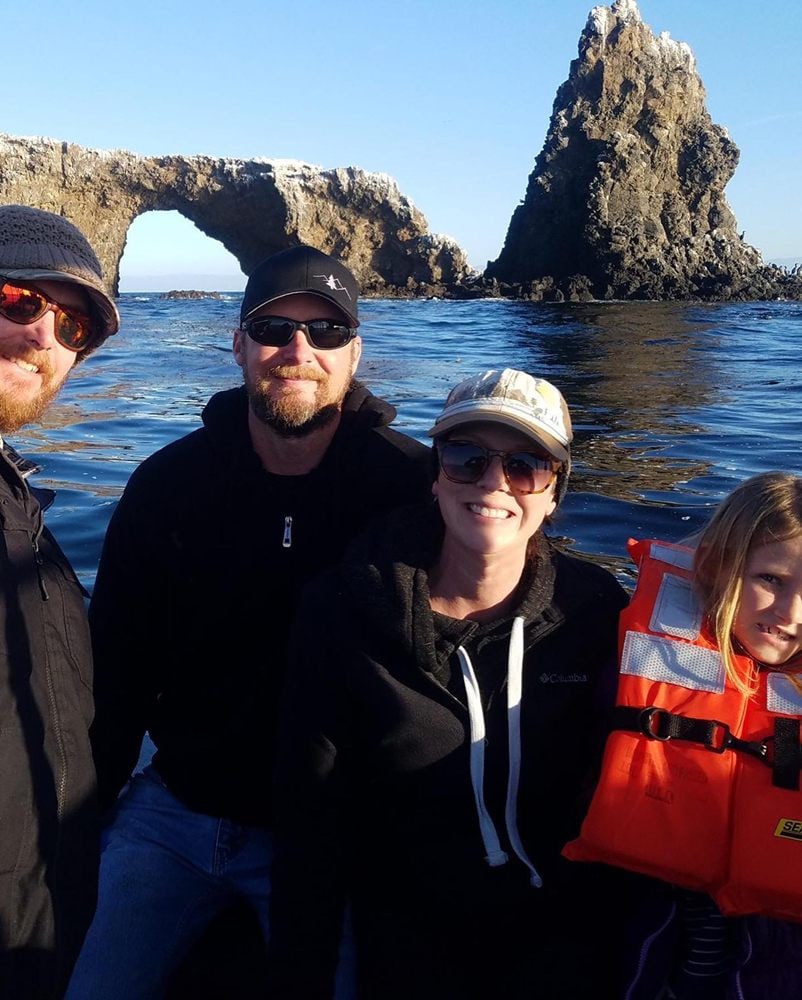 A group of guests in front of Anacapa's arch