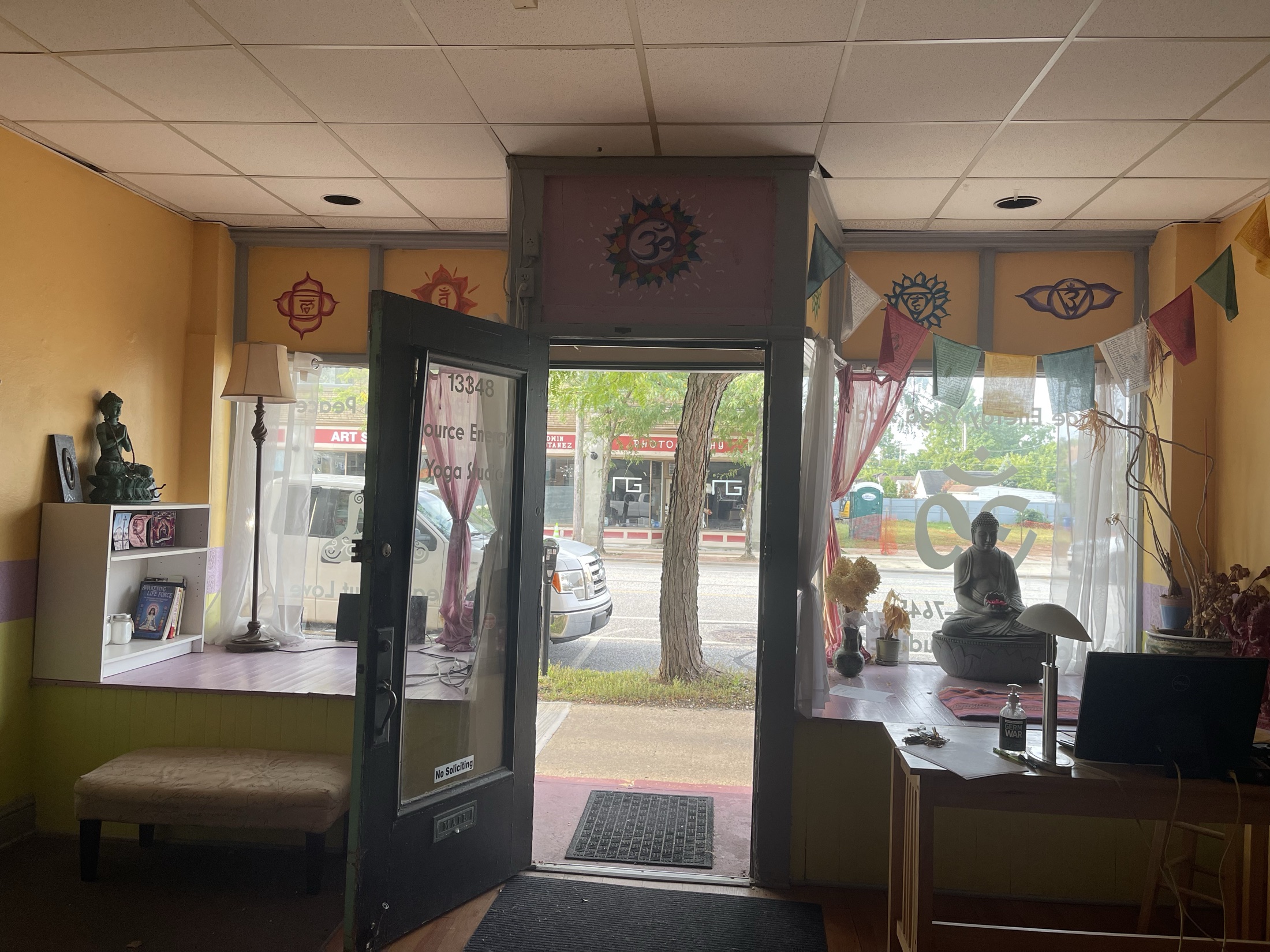 The front room at Lakewood Yoga looking out through the open door onto Madison Avenue
