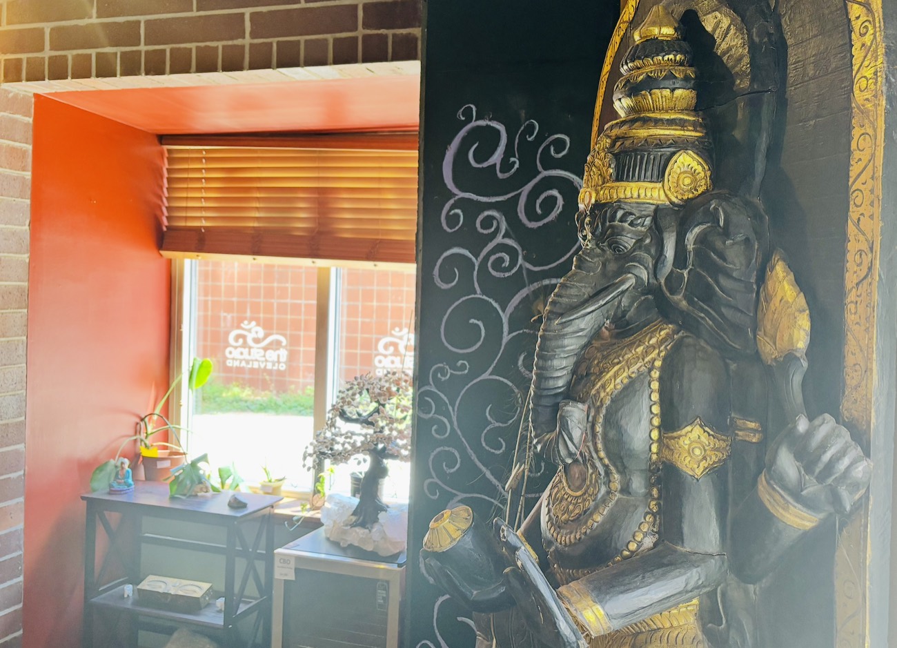 The Ganesha statue in the candlelit practice room at The Studio Cleveland