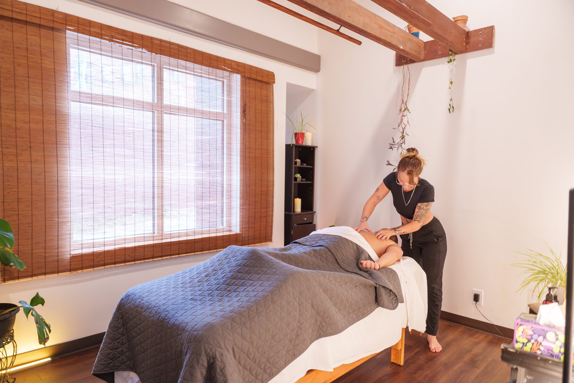 A licensed massage therapist working at The Studio Cleveland, Lakewood Yoga's sister studio downtown