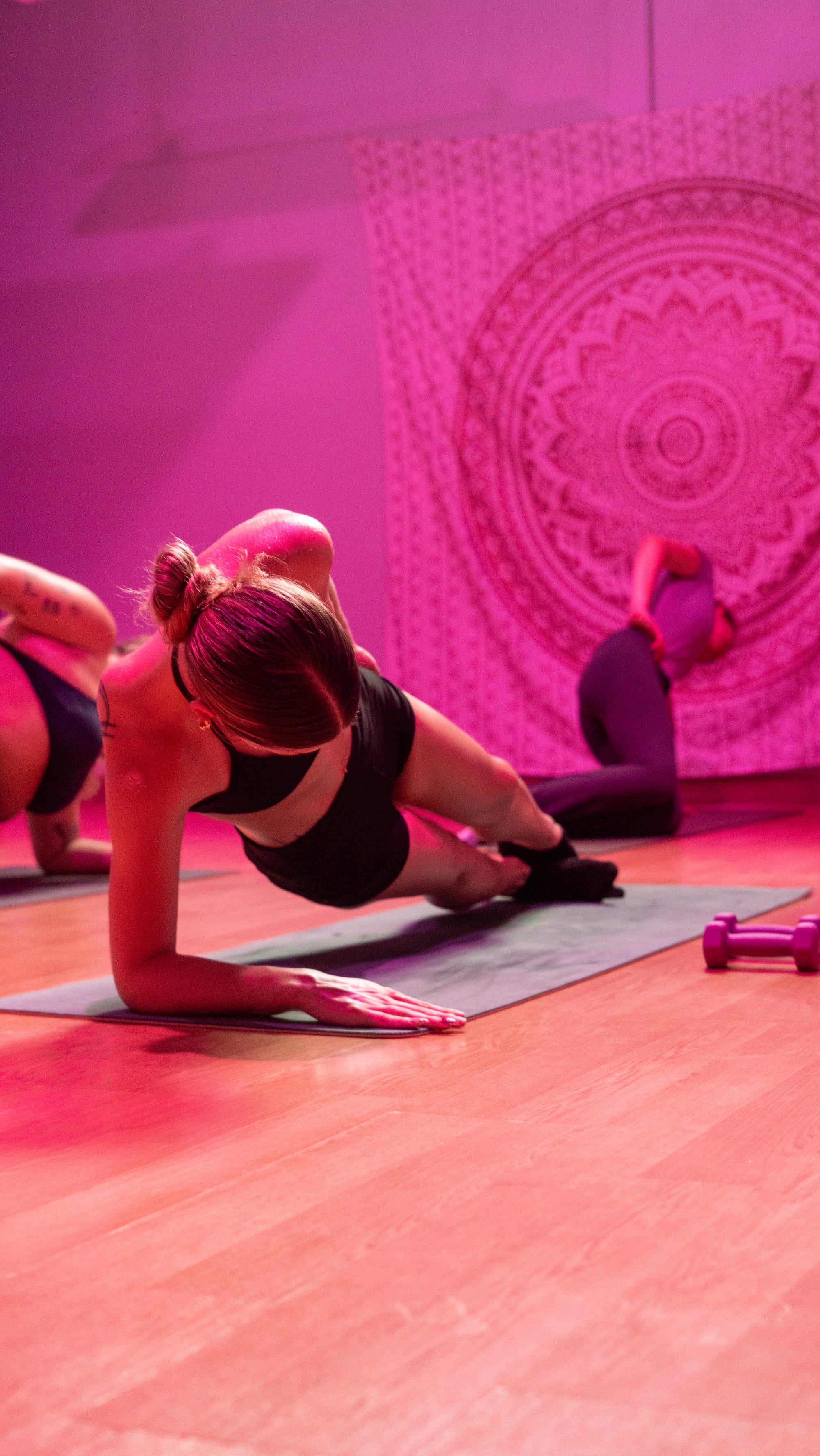 A forearm side plank in a Hot Mat Pilates class at The Studio Cleveland